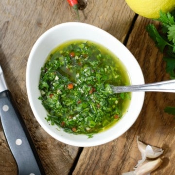 overhead photo of chimichurri in a white porcelain bowl