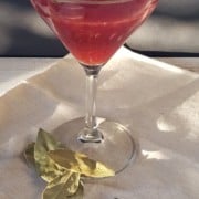 a bayleaf infused cosmopolitan on a white napkin