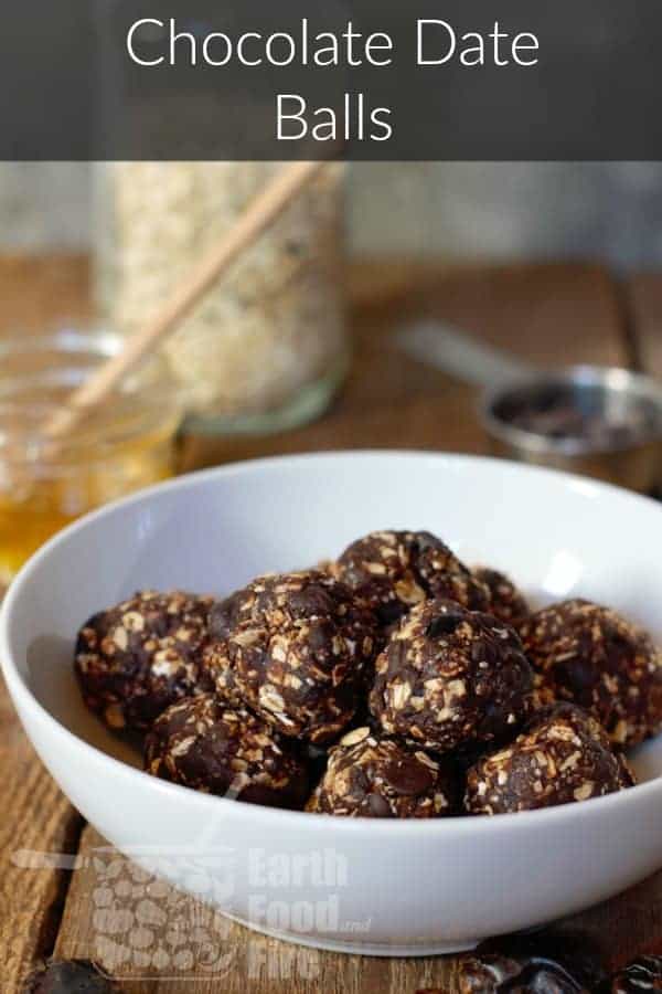 dark chocolate date balls in a white bowl