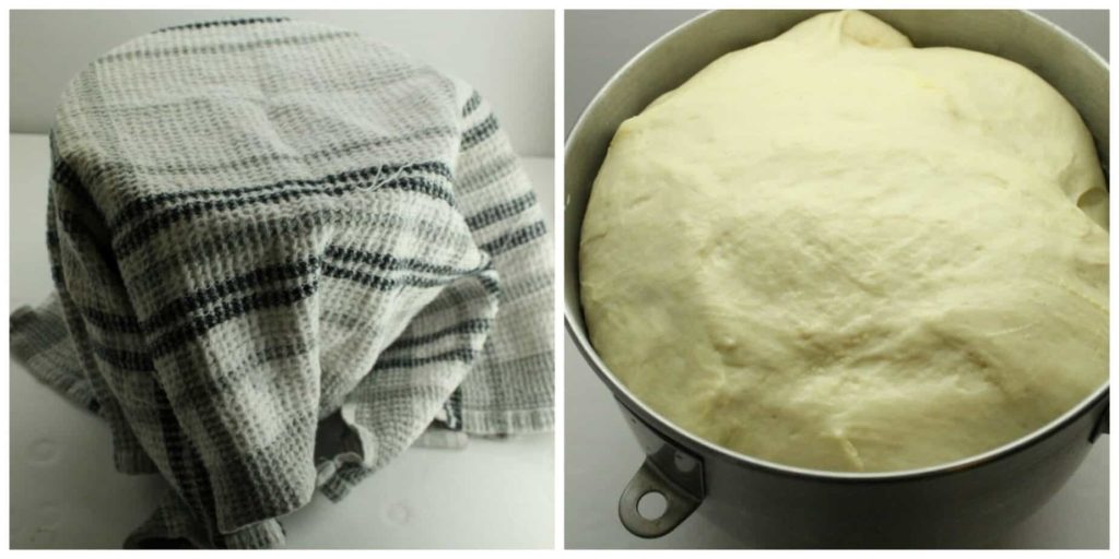 Bread dough proofing in a metal mixing bowl.