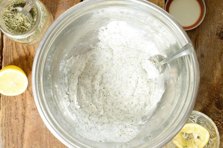 a greek yogurt based marinade in a steel bowl