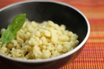 Close up of German spätzle noodles served in a black bowl