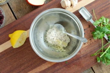 mixing all the ingredients for black peppercorn dressing