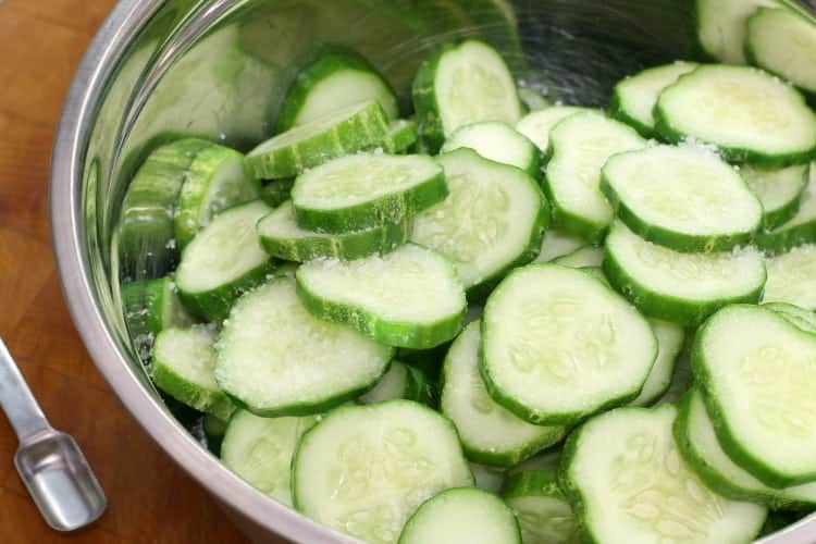 pickling salt sprinkled over top of sliced cucmbers