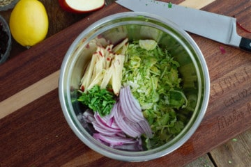 overhead shot of the raw chopped veggies in a steel bowl